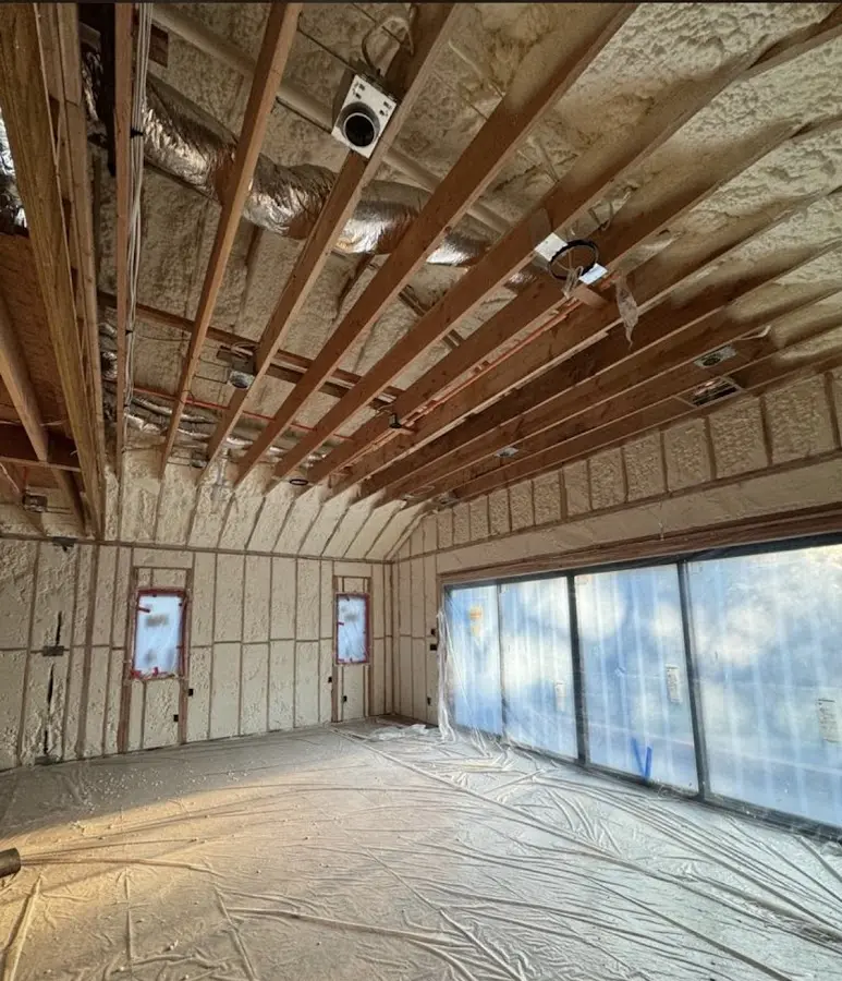 Interior walls and ceiling insulated with spray foam during new construction in Holmen